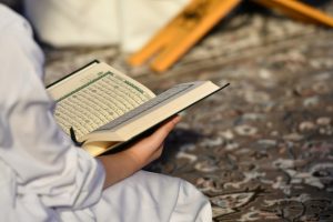 [freepicdownloader.com]-people-reading-holy-quran-normal